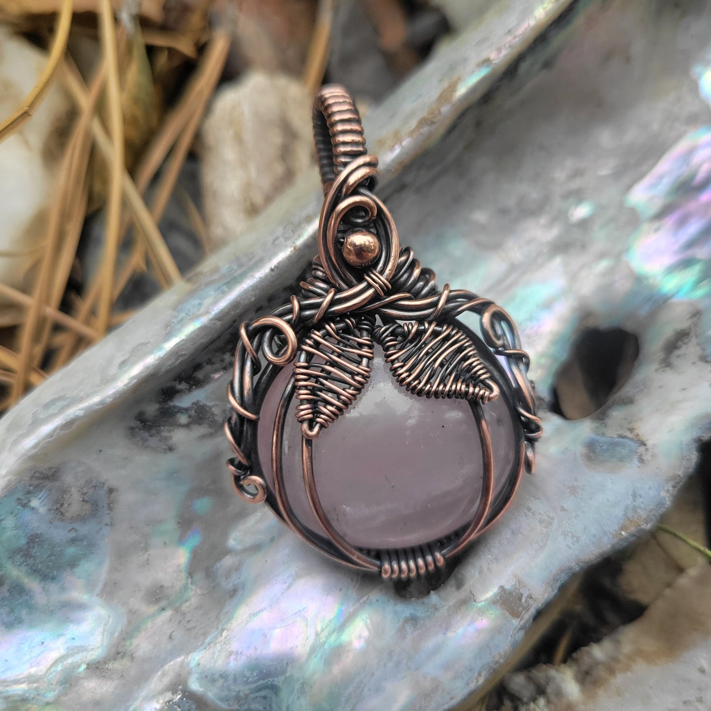 Handcrafted Rose Quartz Oxidized Copper Pumpkin Pendant Necklace — close-up