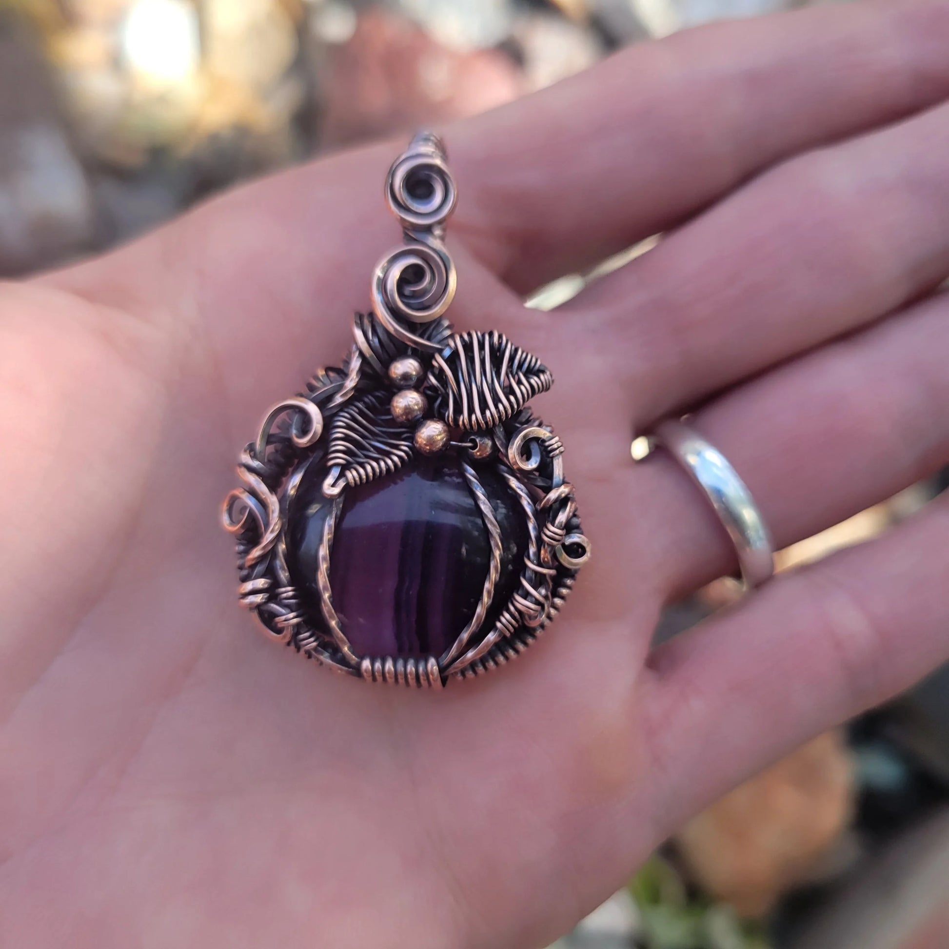 Handcrafted Purple Fluorite Oxidized Copper Pumpkin Pendant Necklace — side view