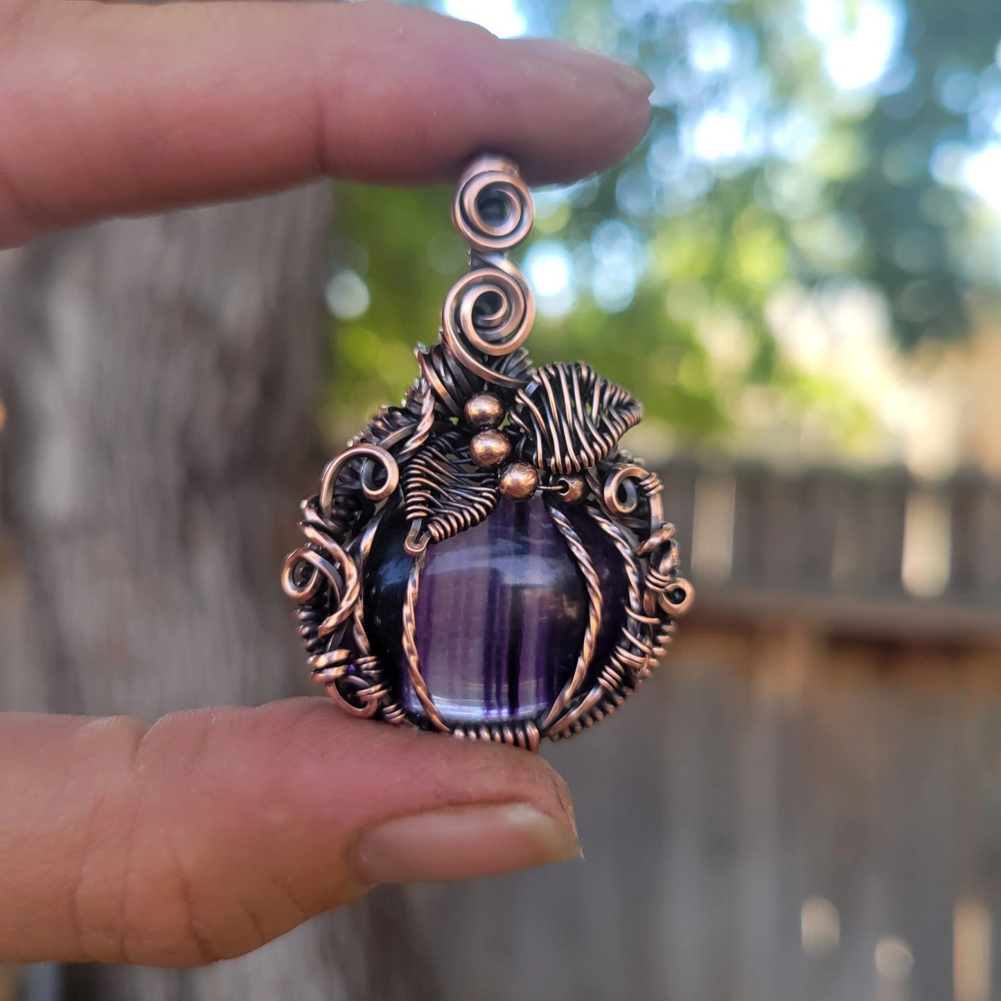 Handcrafted Purple Fluorite Oxidized Copper Pumpkin Pendant Necklace — close-up