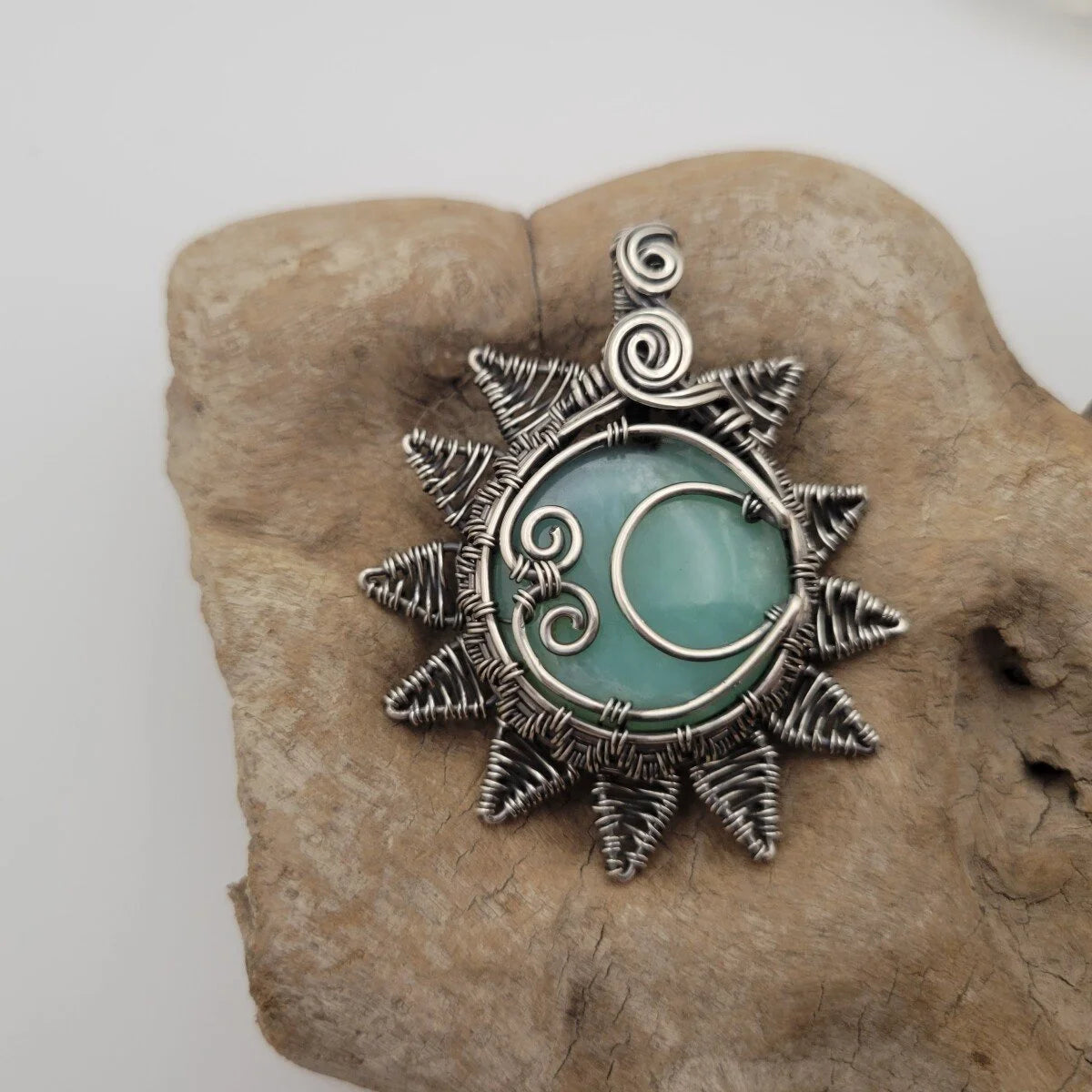 Handcrafted Blue Peruvian Opal Sterling Silver Sun and Moon Pendant Necklace — close-up