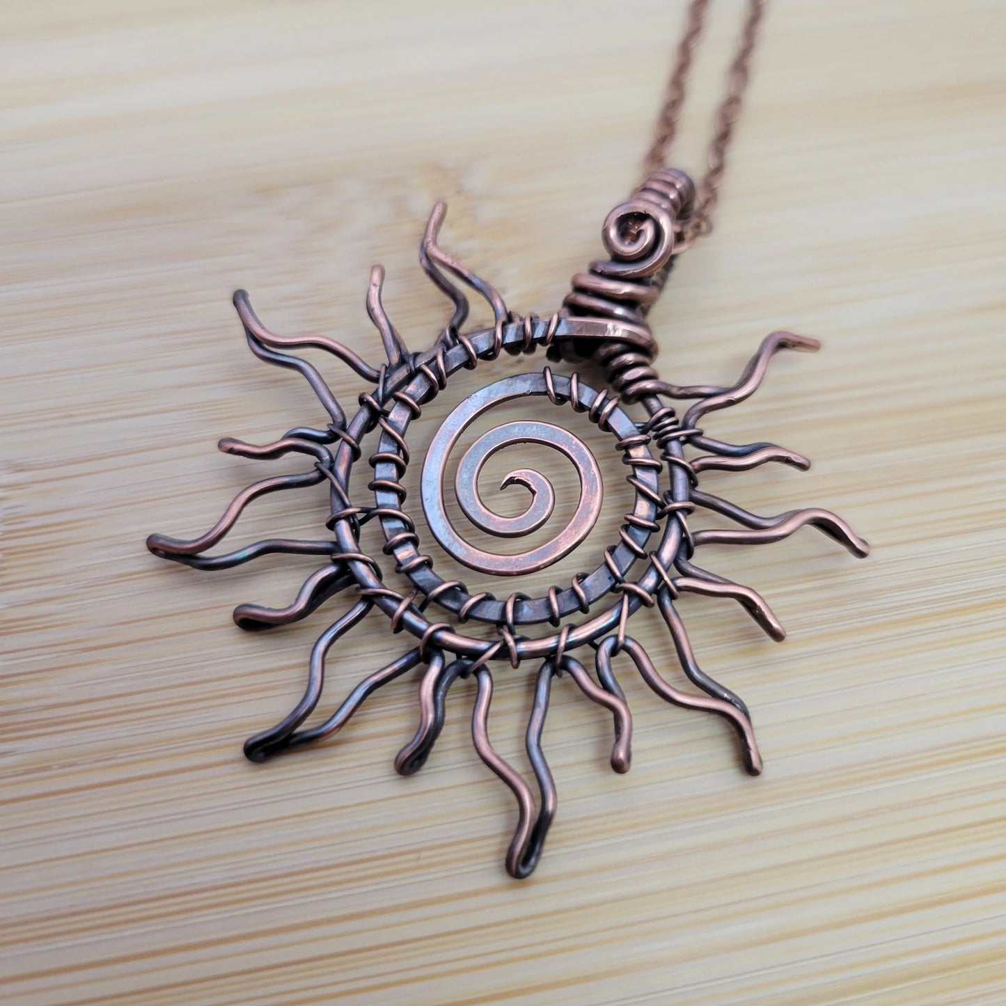 Handcrafted Copper Sun Pendant Necklace — side view