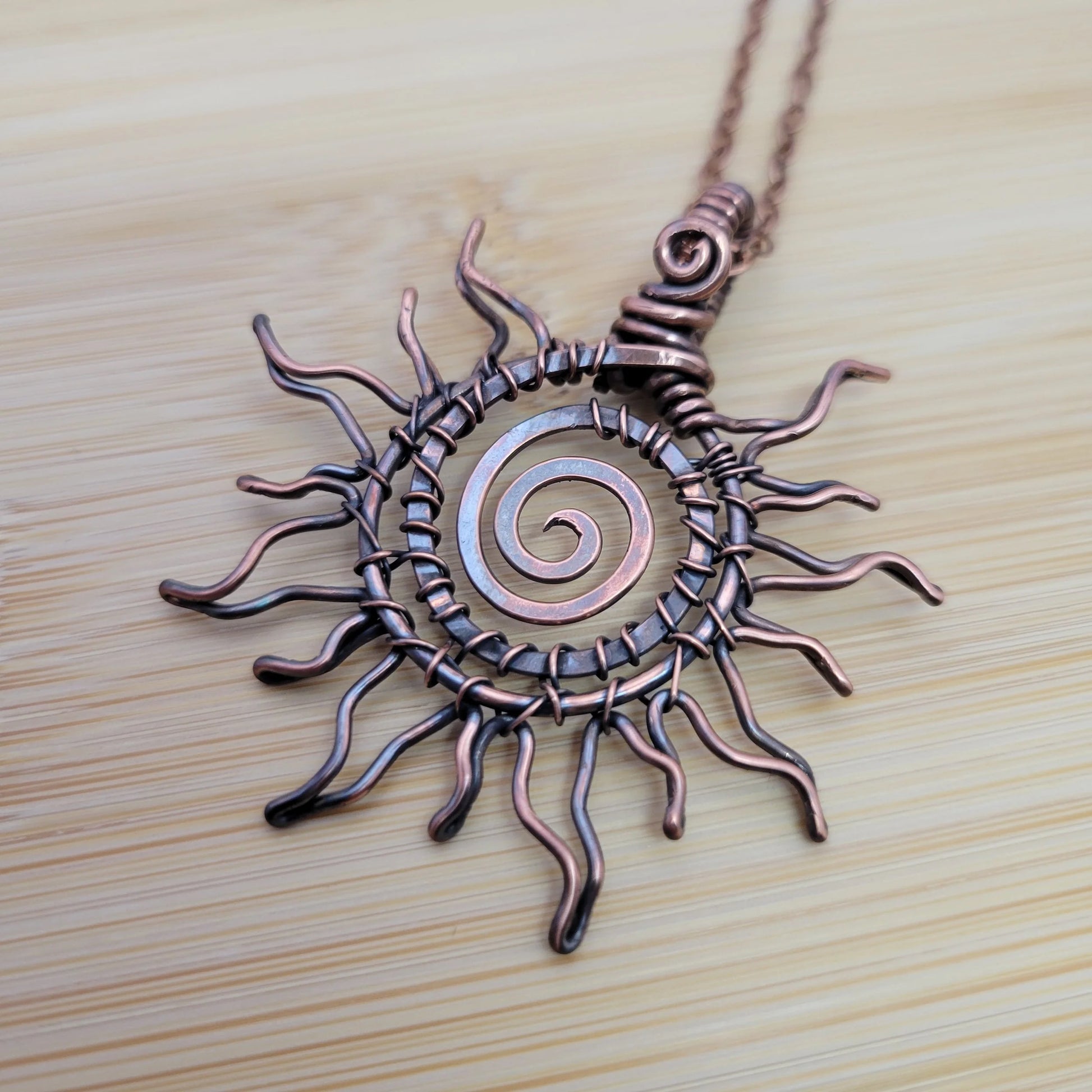 Handcrafted Copper Sun Pendant Necklace — side view