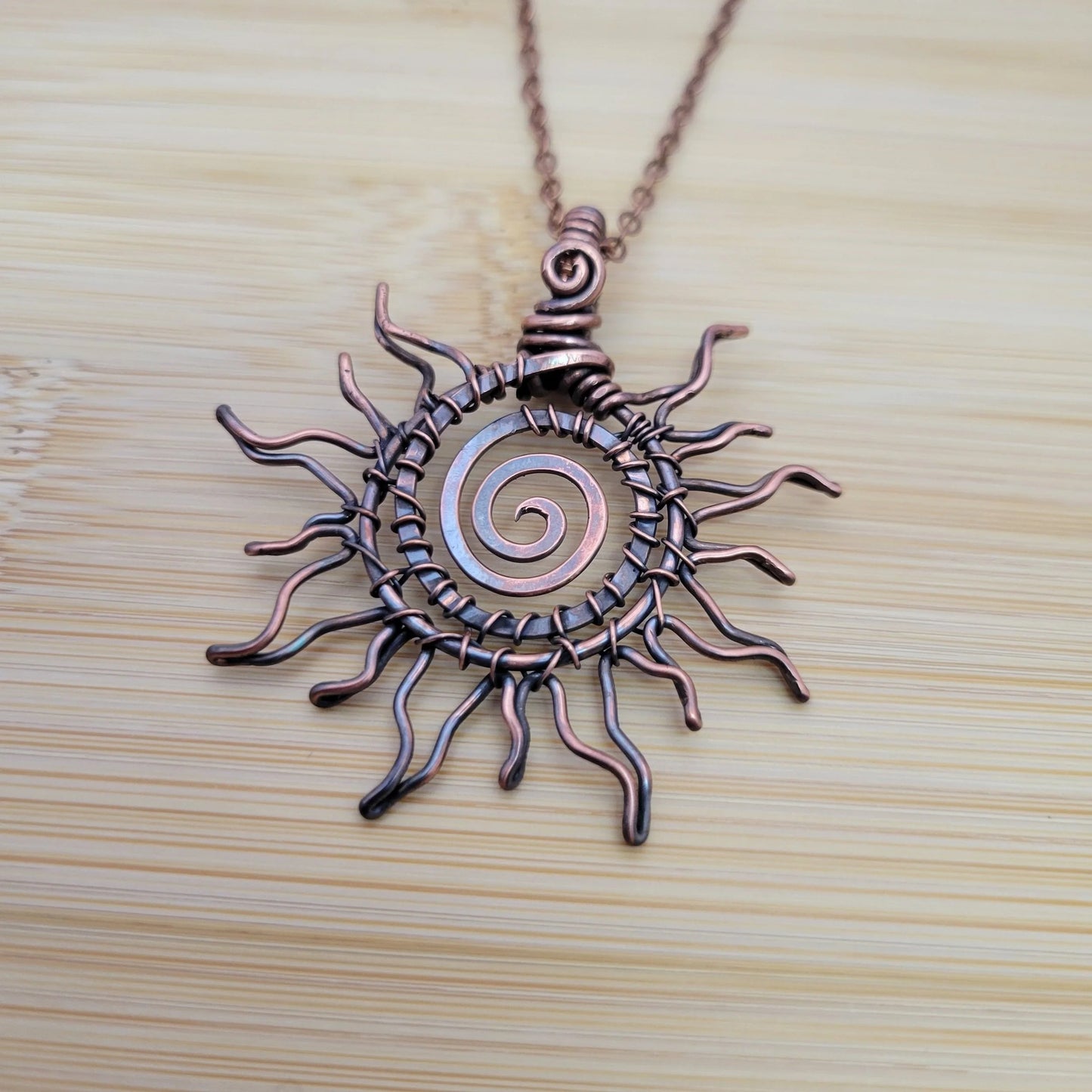 Handcrafted Copper Sun Pendant Necklace — close-up