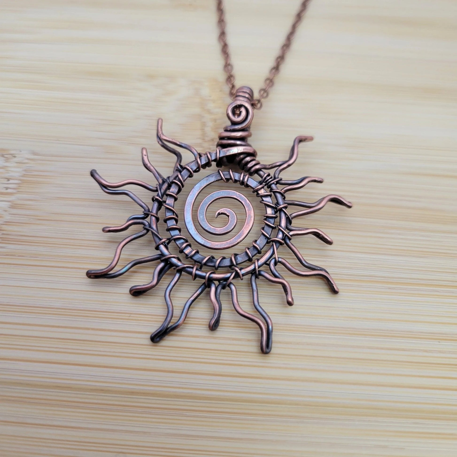 Handcrafted Copper Sun Pendant Necklace — close-up