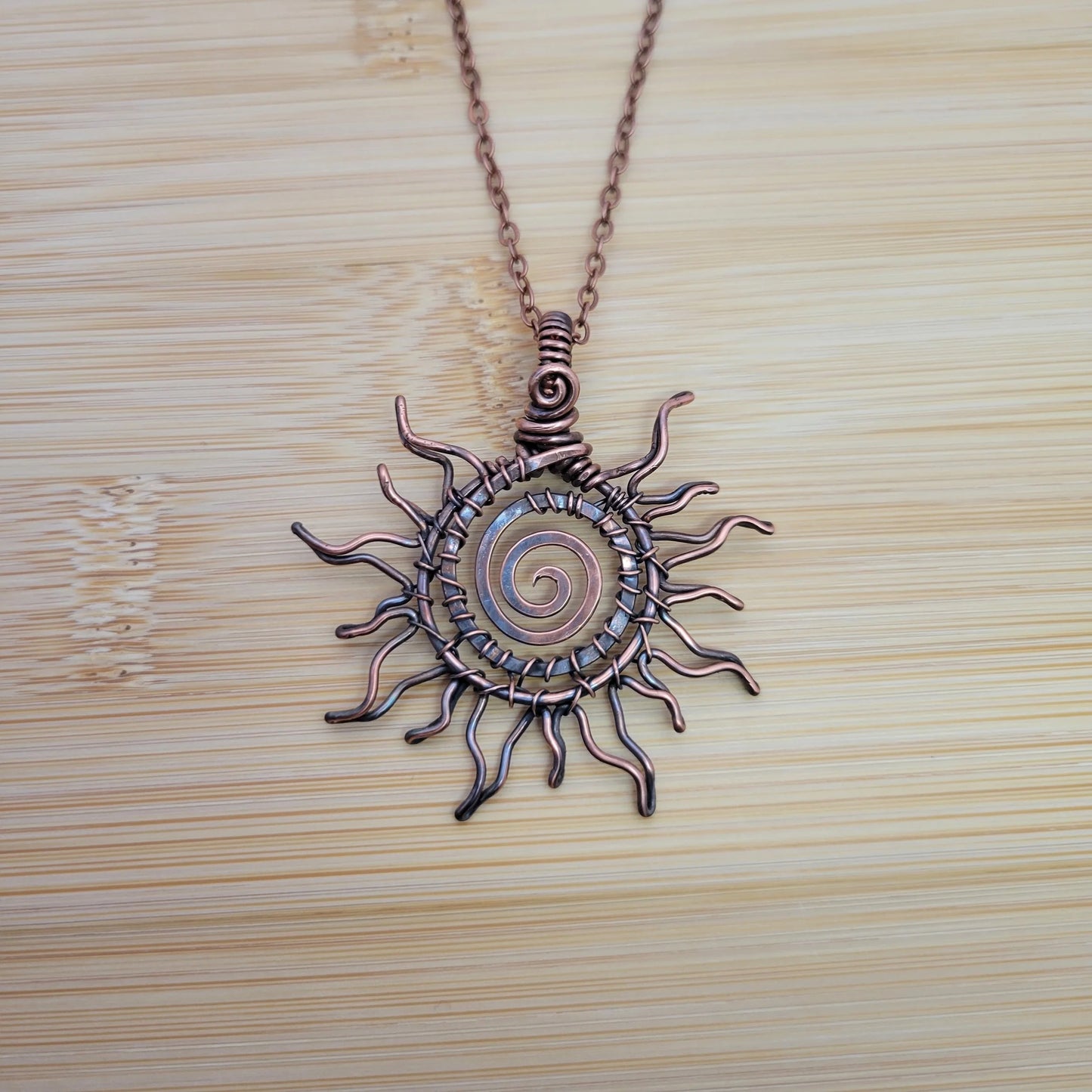 Handcrafted Copper Sun Pendant Necklace — detail view