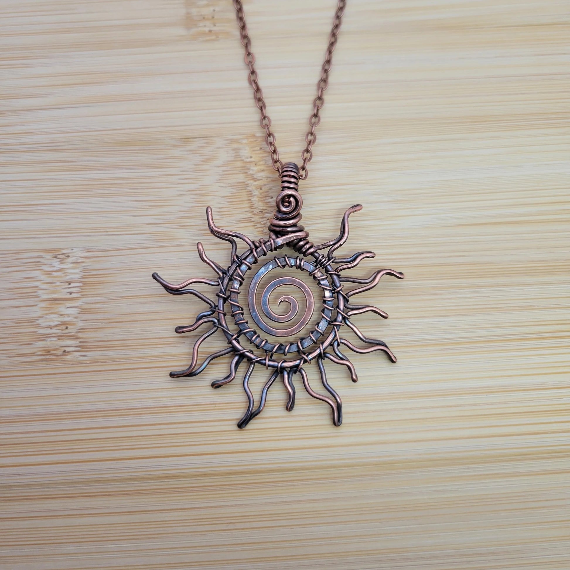 Handcrafted Copper Sun Pendant Necklace — detail view