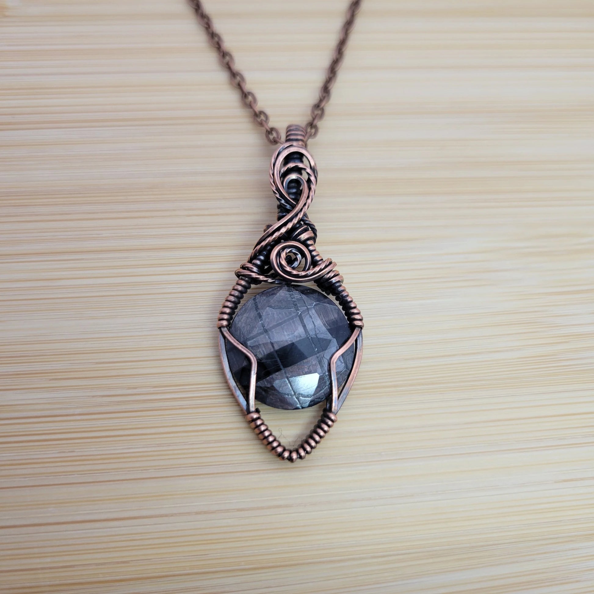 Handcrafted Silver Sheen Obsidian Copper Pendant Necklace — front view