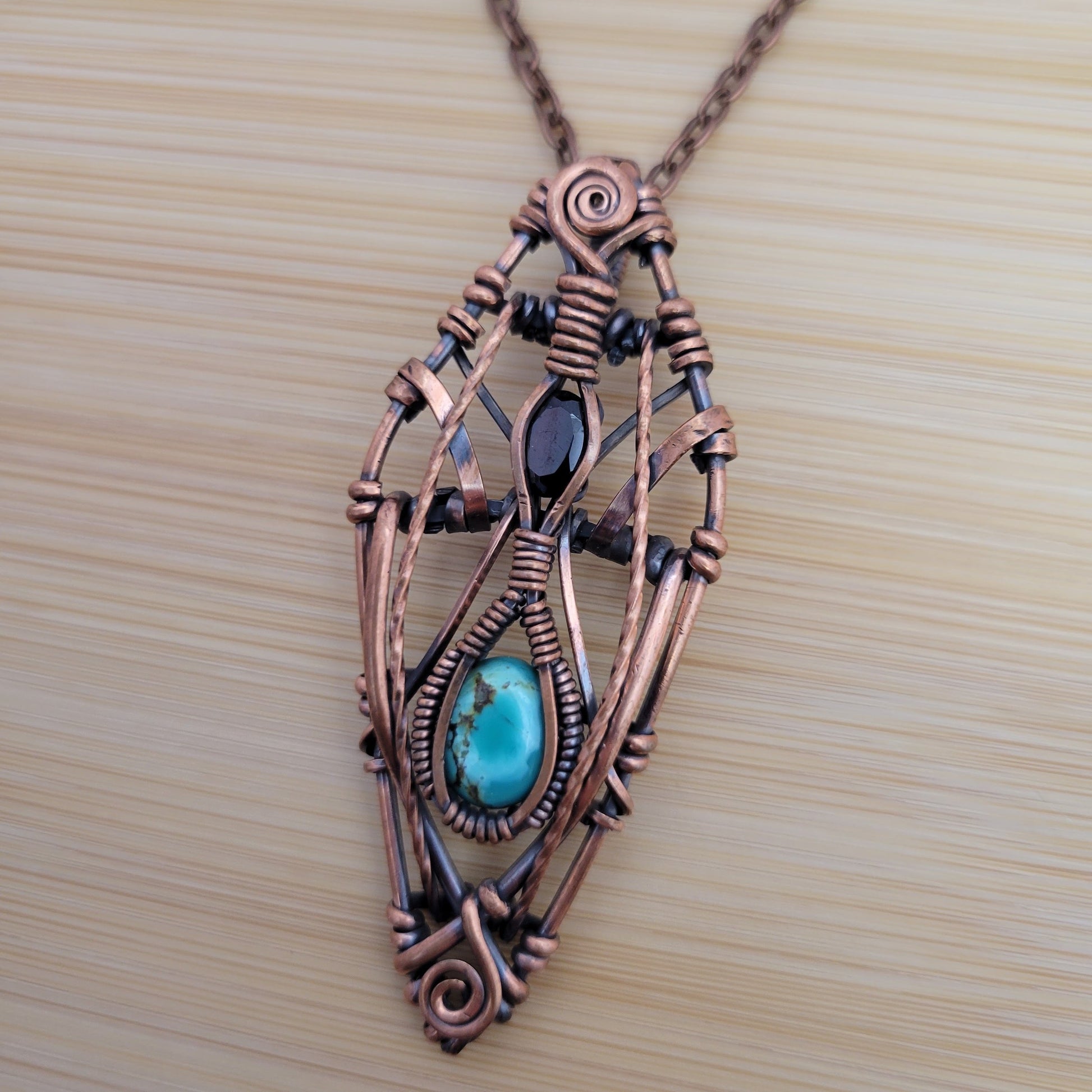 Handcrafted Garnet and Turquoise Copper Pendant Necklace — close-up