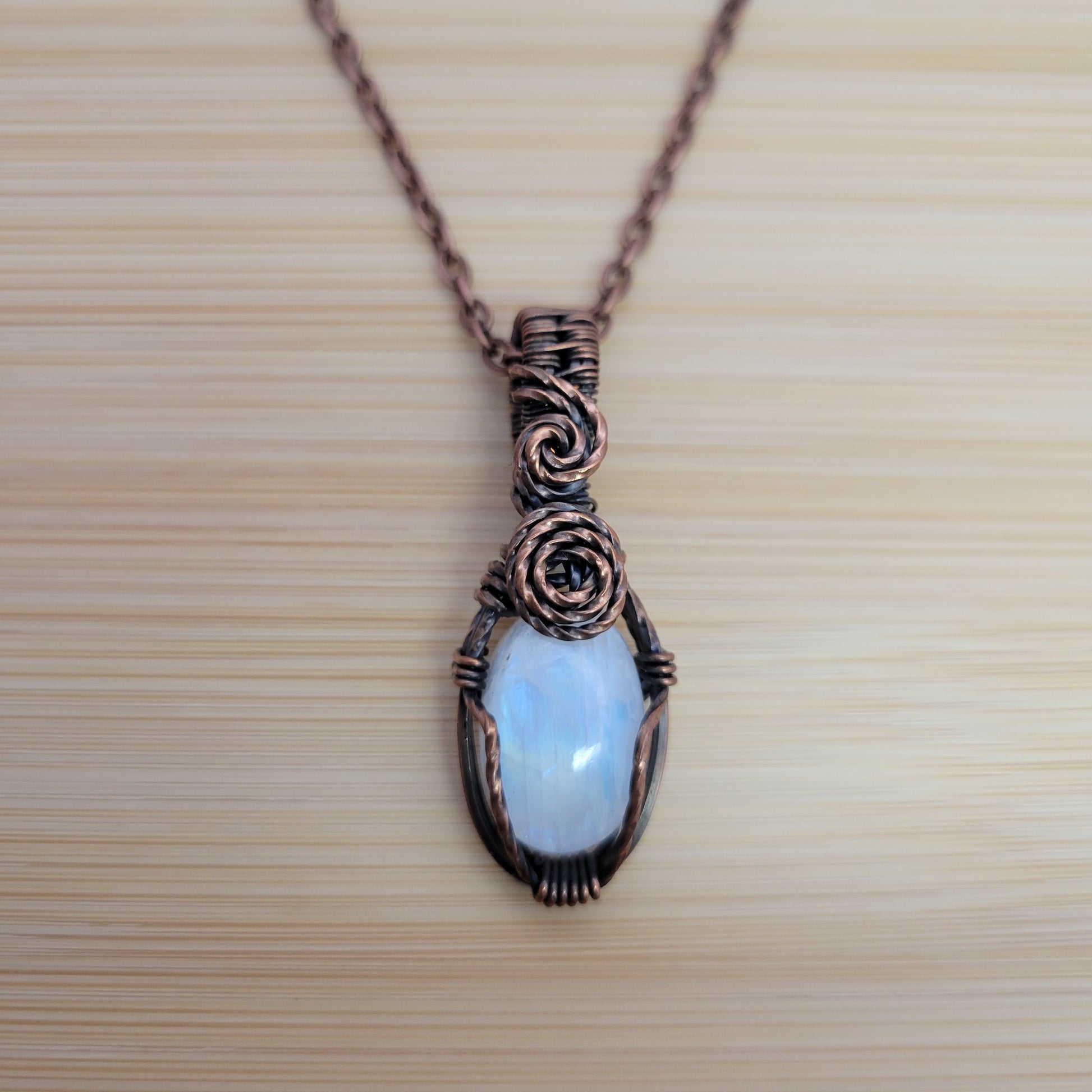 Handcrafted Rainbow Moonstone and Moonstone Copper Pendant Necklace — front view