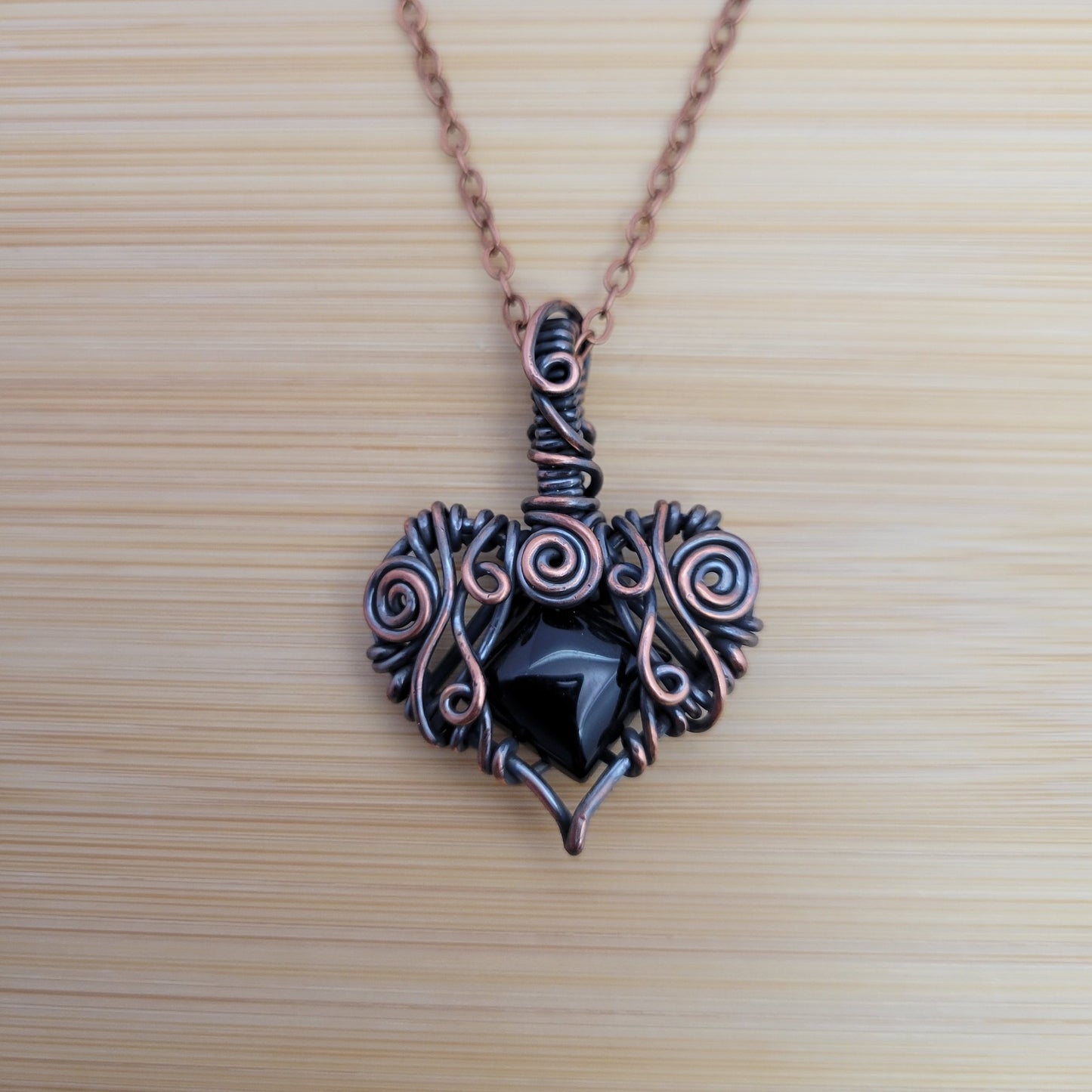 Handcrafted Black Onyx Copper Heart Pendant Necklace — reverse view