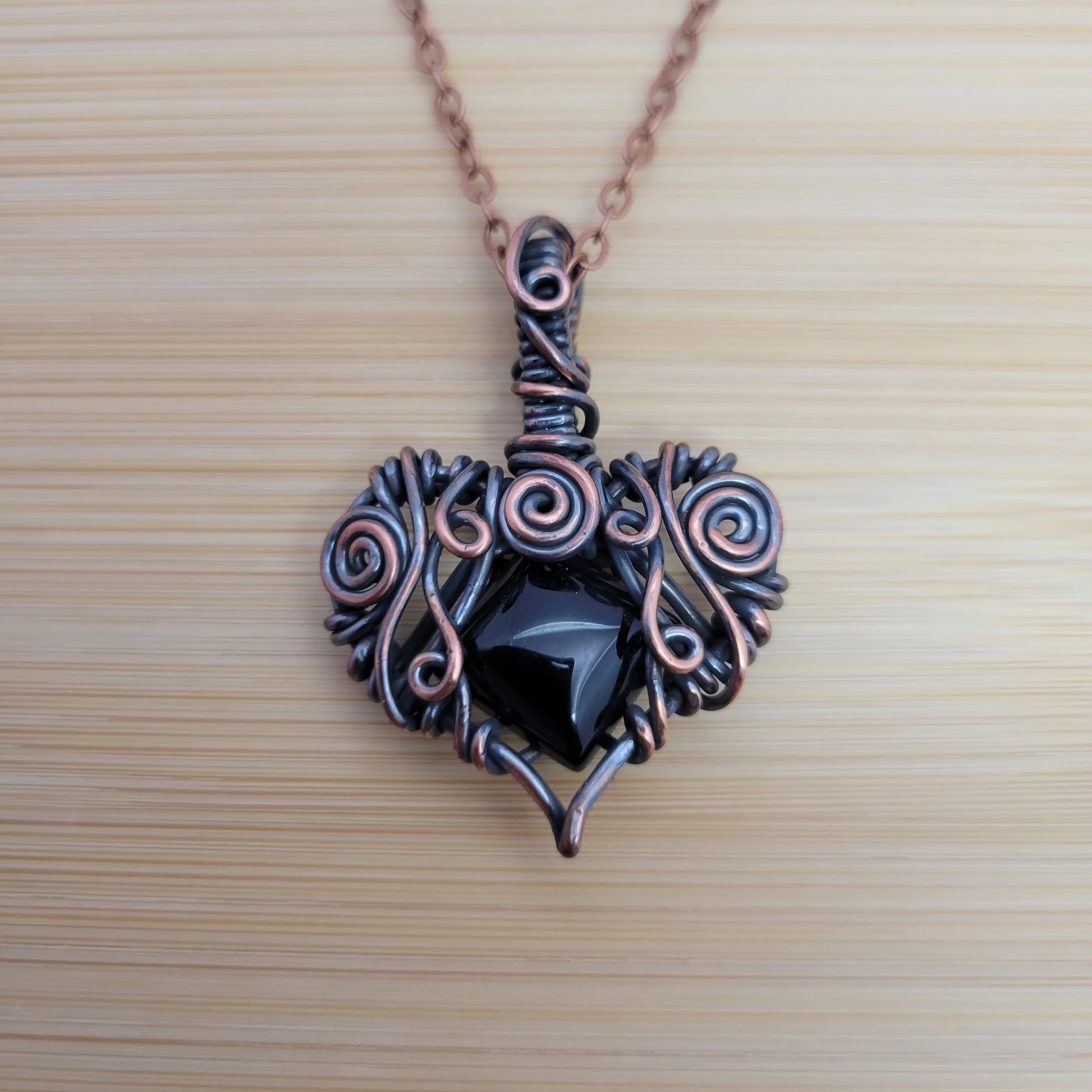 Handcrafted Black Onyx Copper Heart Pendant Necklace — front view