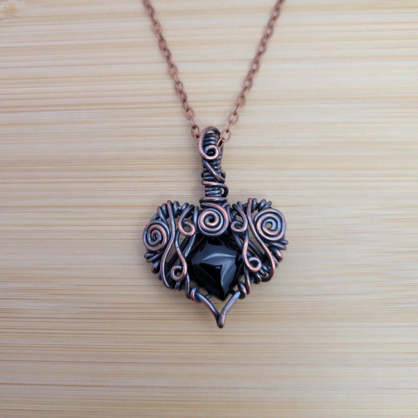 Handcrafted Black Onyx Copper Heart Pendant Necklace — close-up