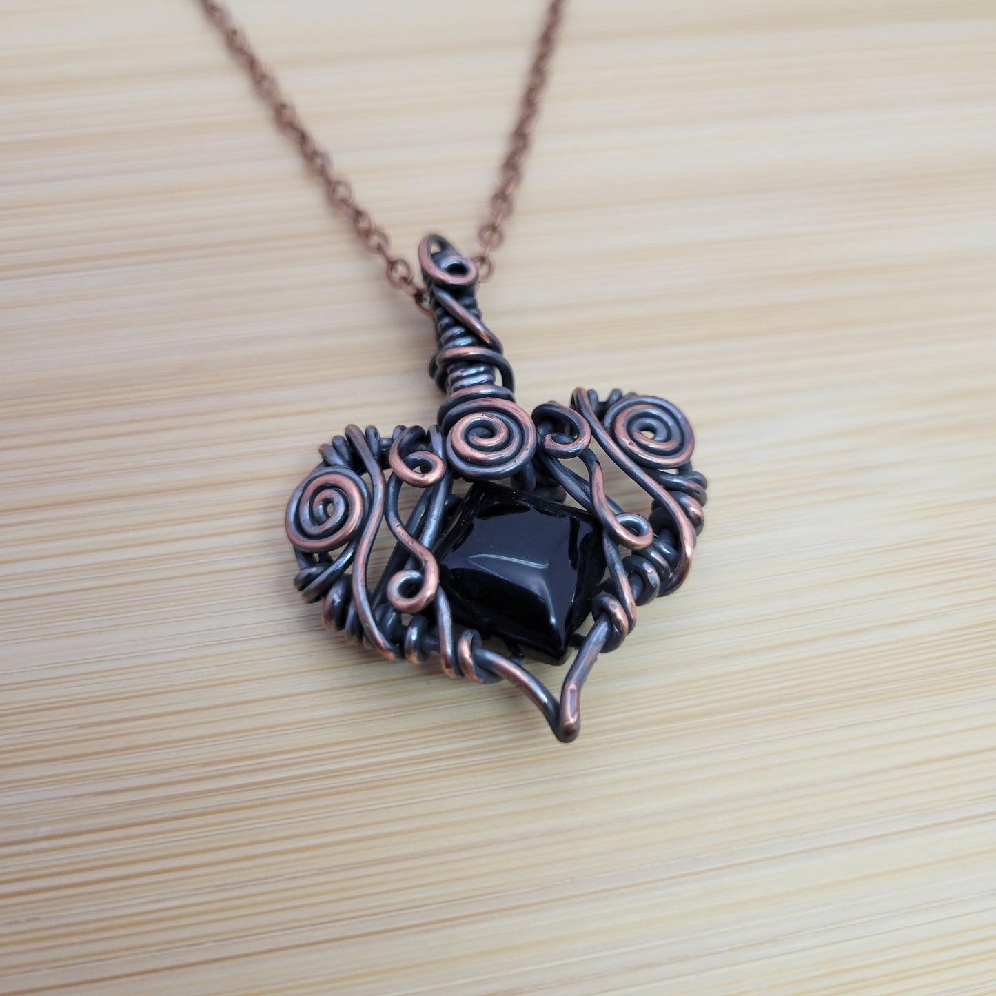Handcrafted Black Onyx Copper Heart Pendant Necklace — side view