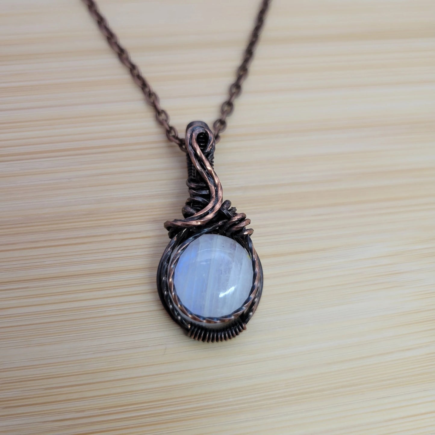 Handcrafted Rainbow Moonstone and Moonstone Copper Pendant Necklace — close-up