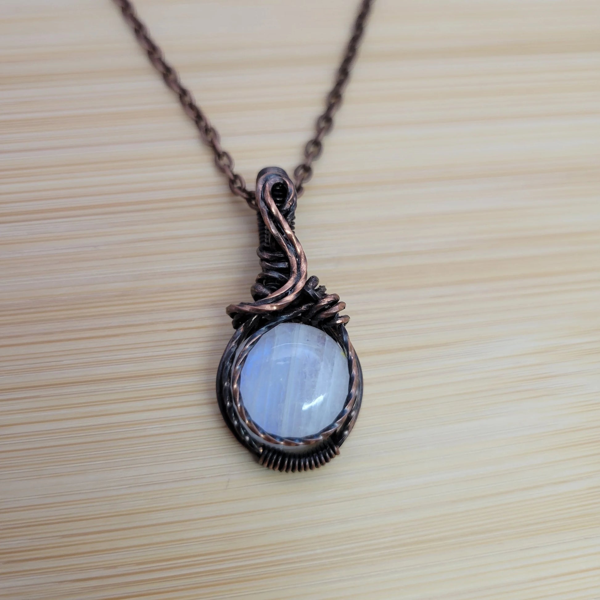 Handcrafted Rainbow Moonstone and Moonstone Copper Pendant Necklace — close-up