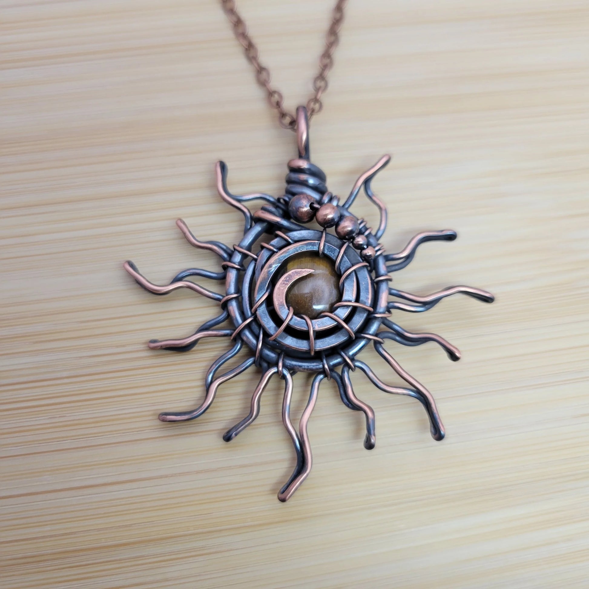 Handcrafted Tiger's Eye Copper Sun Pendant Necklace — front view