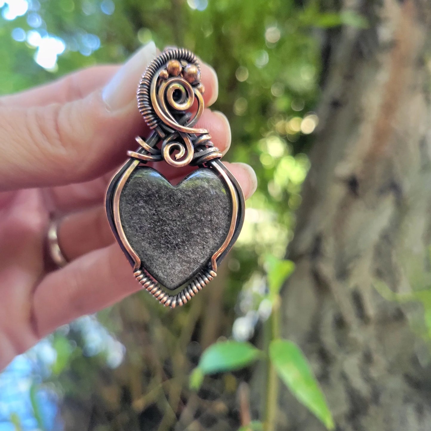 Handcrafted Silver Sheen Obsidian Copper Heart Pendant Necklace — close-up