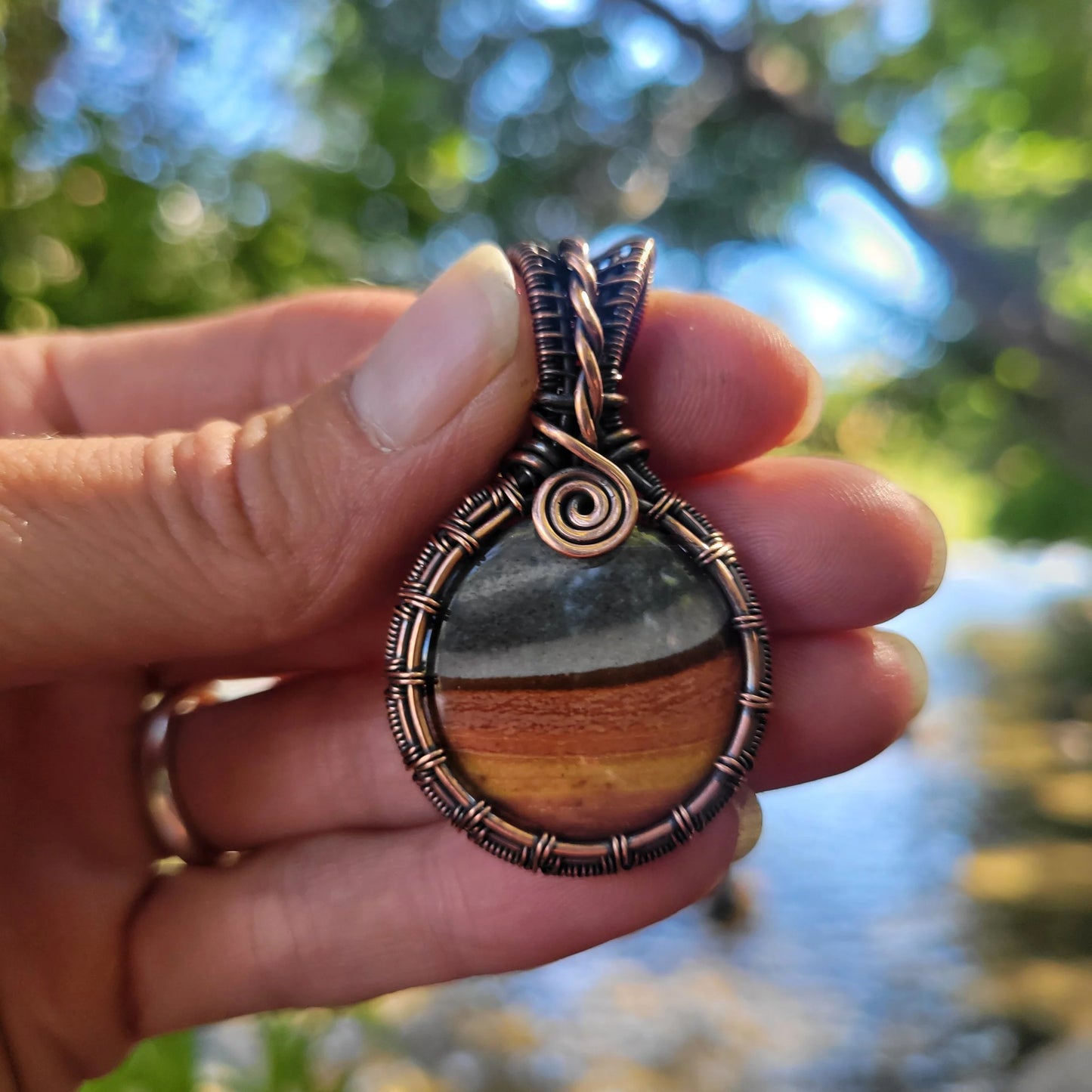 Handcrafted Polychrome Jasper Copper Pendant Necklace — close-up